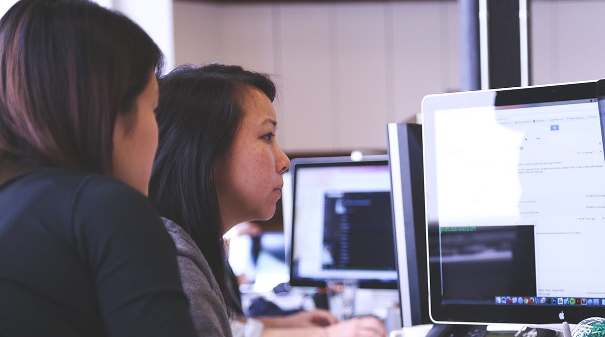 Two women at a computer Two women at a computer
